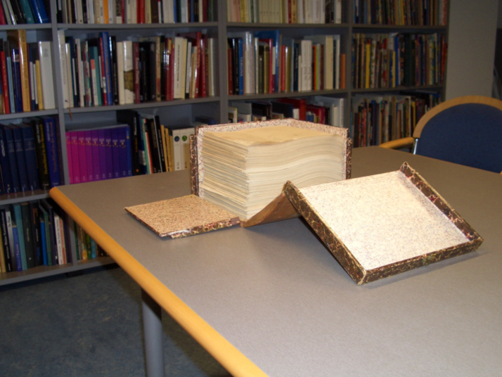 Bookshelves, table with old note inventory